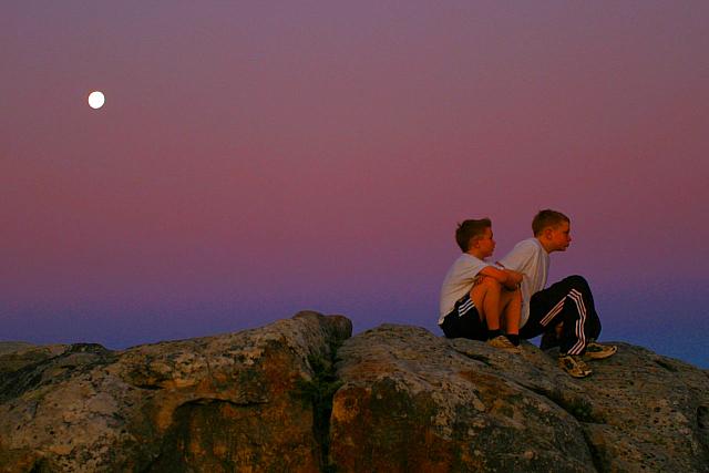 2 boys enjoying the moonlight on table mountain