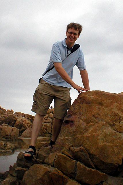 Johan climbing rocks in Plettenberg bay