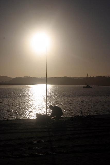 Boy fishing close to sunset