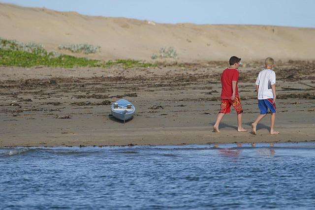 Boat and boys on Nahoon beach