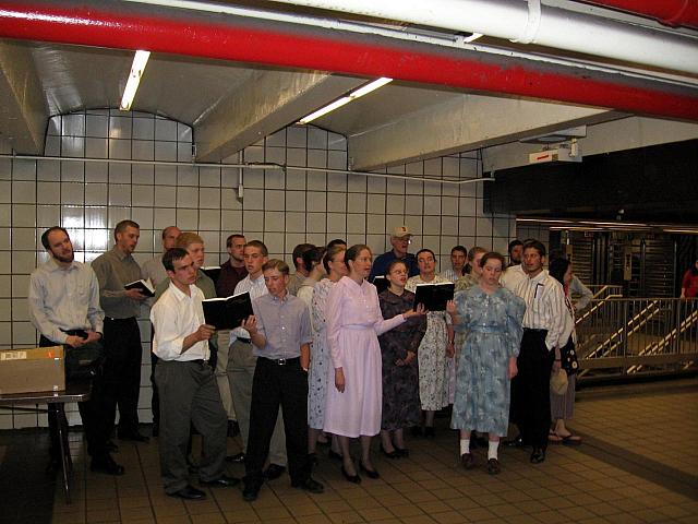 Religous people singing (very badly) in the underground