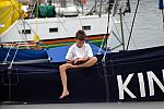Boy reading on boat in Knysna