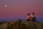 2 boys enjoying the moonlight on table mountain